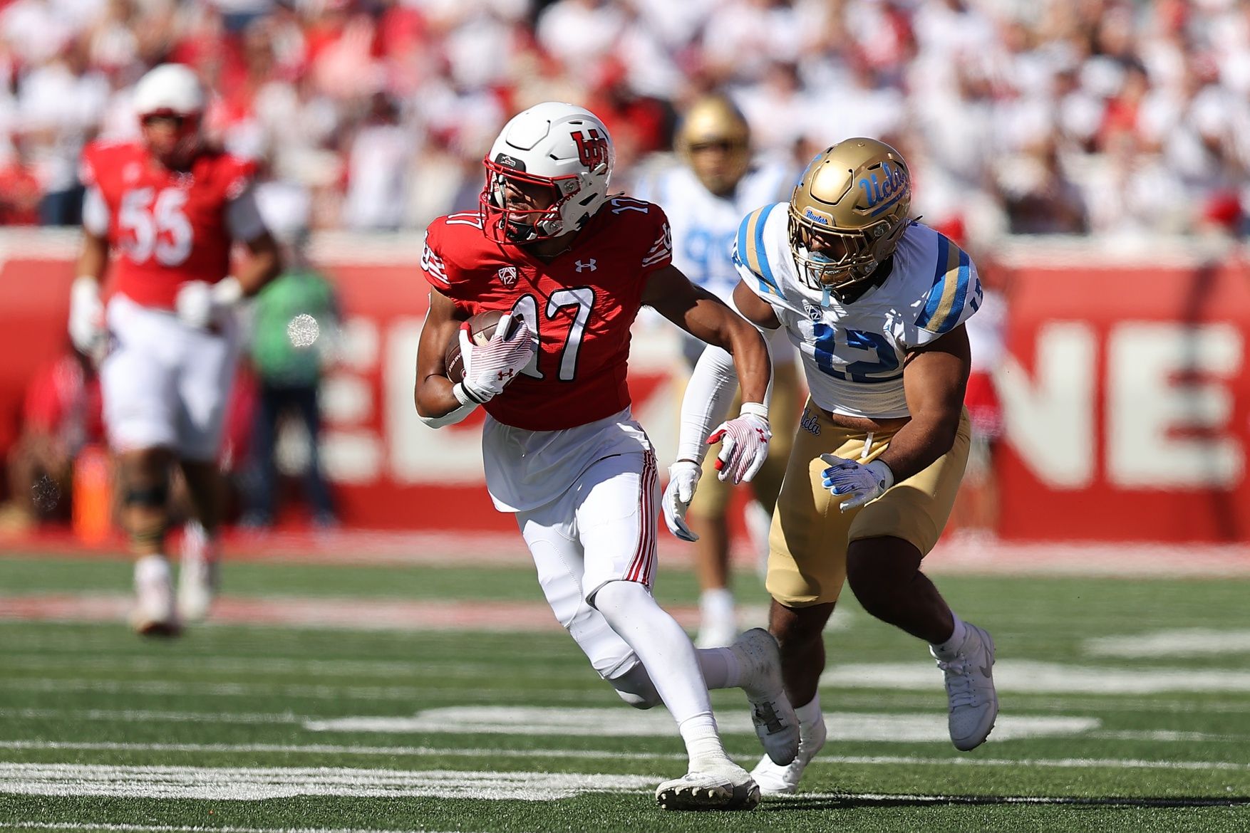 Utah Utes wide receiver Devaughn Vele gains yards after the catch against UCLA.