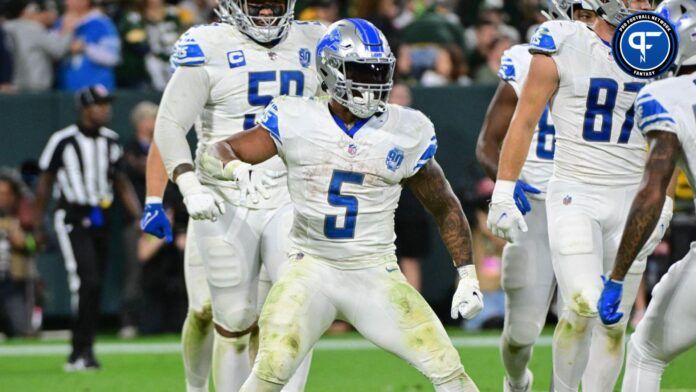 David Montgomery (5) reacts after scoring a touchdown in the fourth quarter against the Green Bay Packers at Lambeau Field.