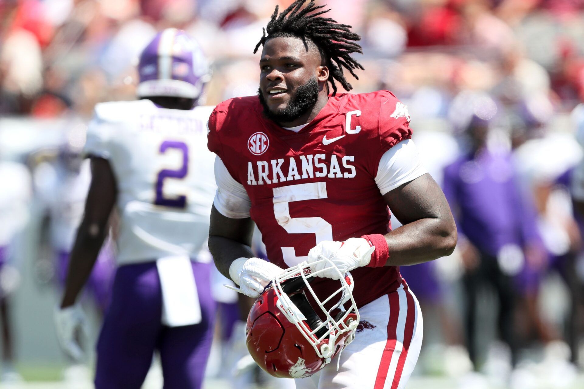 Raheim Sanders (5) returns to the sidelines after losing his helmet on the previous play in the second quarter against the Western Carolina Catamounts at War Memorial Stadium.