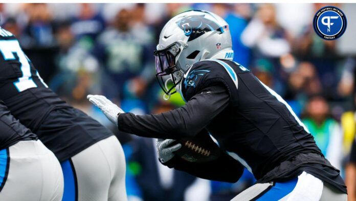 Carolina Panthers running back Miles Sanders (6) rushes against the Seattle Seahawks during the first quarter at Lumen Field.