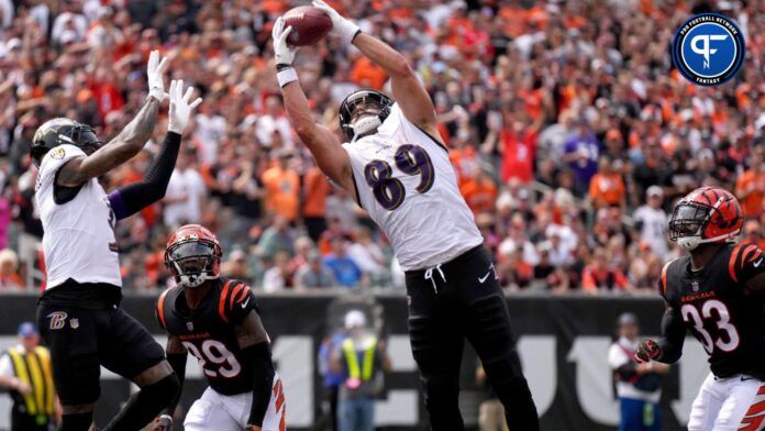 Baltimore Ravens tight end Mark Andrews (89) collects a pass in the end zone as Cincinnati Bengals cornerback Cam Taylor-Britt (29) defends in the second quarter at Paycor Stadium.