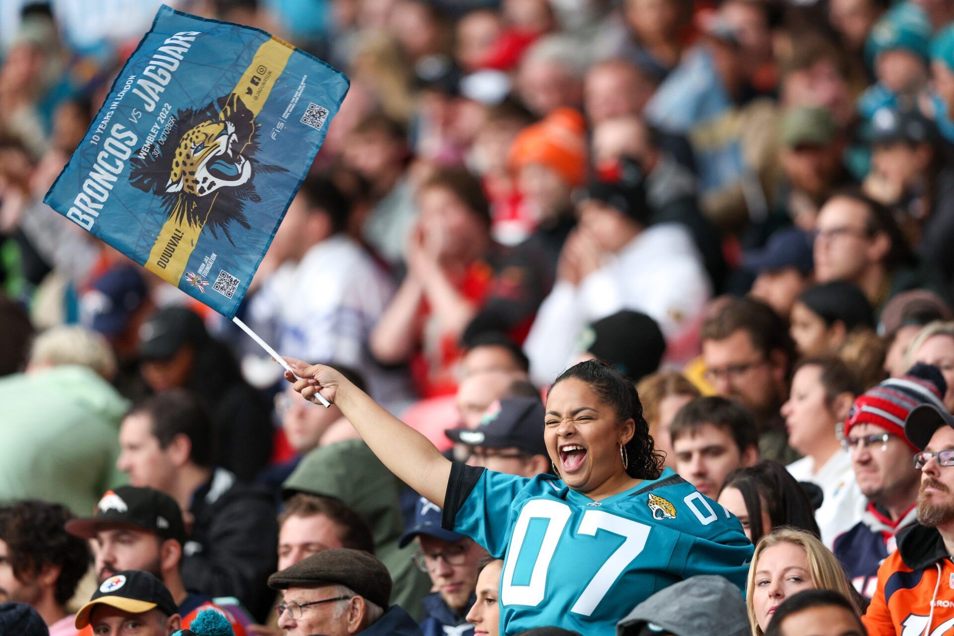 A fan waves a flag during a game featuring the Denver Broncos and Jacksonville Jaguars during an NFL International Series game at Wembley Stadium.