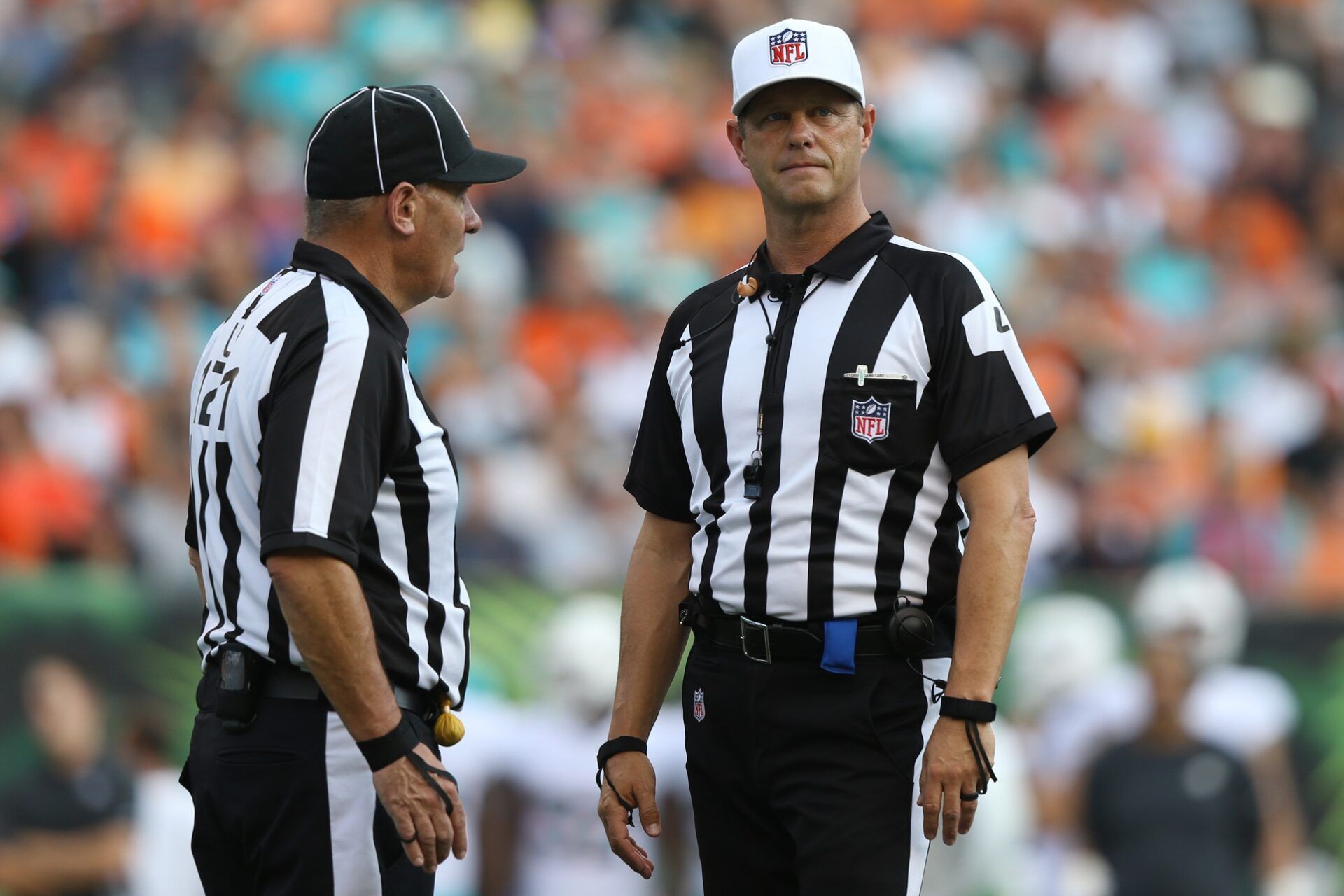 NFL umpire Paul King (left) stands with NFL referee Craig Wrolstad (right) in the game of the Miami Dolphins against the Cincinnati Bengals at Paul Brown Stadium.