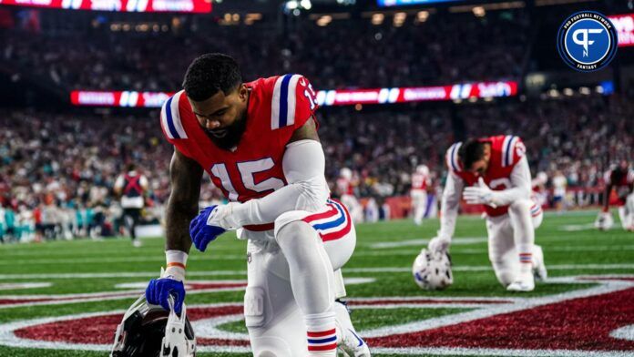 New England Patriots RB Ezekiel Elliot takes a moment before the game vs. Miami Dolphins.