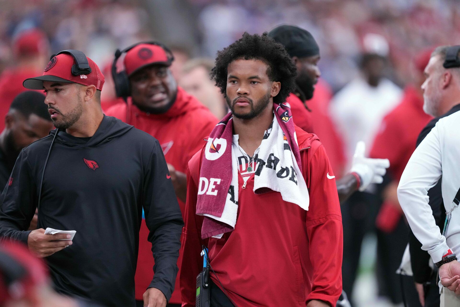 Arizona Cardinals QB Kyler Murray looks on from the sidelines in the game against the Dallas Cowboys.