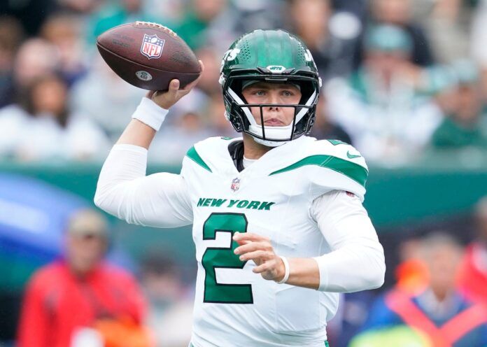 New York Jets quarterback Zach Wilson throws the ball against the New England Patriots in the first half of his team's loss at MetLife Stadium.