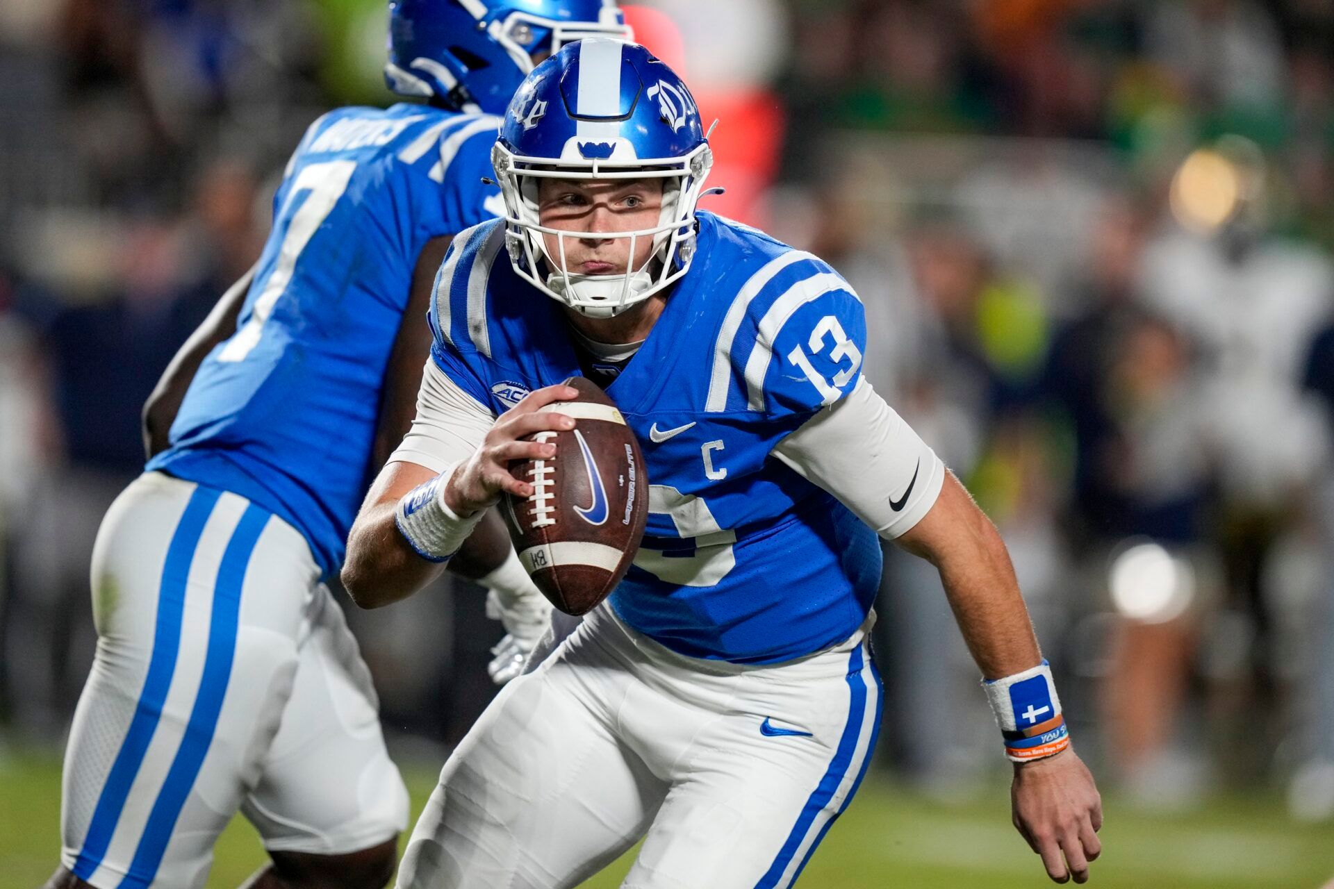 Sep 30, 2023; Durham, North Carolina, USA; Duke Blue Devils quarterback Riley Leonard (13) is forced to run during the second quarter against the Notre Dame Fighting Irish at Wallace Wade Stadium. Mandatory Credit: Jim Dedmon-USA TODAY Sports