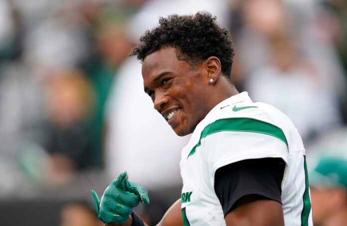 New York Jets wide receiver Garrett Wilson (17) gestures to the fans during warmups before the Jets take on the New England Patriots at MetLife Stadium on Sunday, Sept. 24, 2023, in East Rutherford.