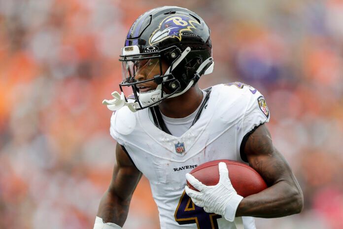 Sep 17, 2023; Cincinnati, Ohio, USA; Baltimore Ravens wide receiver Zay Flowers (4) runs with the ball against the Cincinnati Bengals in the second half at Paycor Stadium. Mandatory Credit: Katie Stratman-USA TODAY Sports