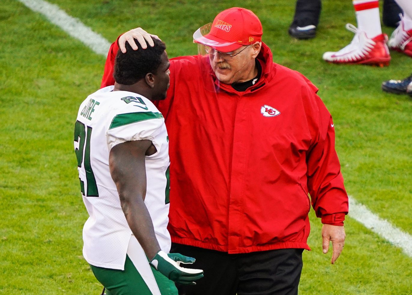 Kansas City, Missouri, USA; Kansas City Chiefs head coach Andy Reid talks with New York Jets running back Frank Gore (21) after the game at Arrowhead Stadium.