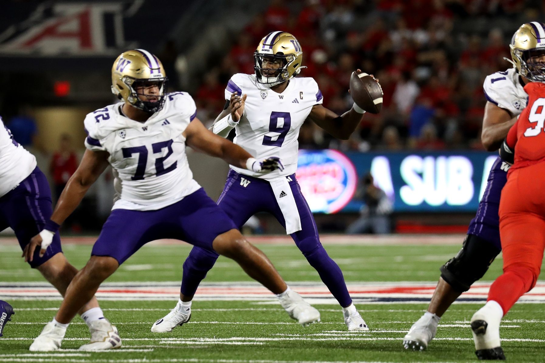 Washington Huskies QB Michael Penix Jr. (9) throws a pass.