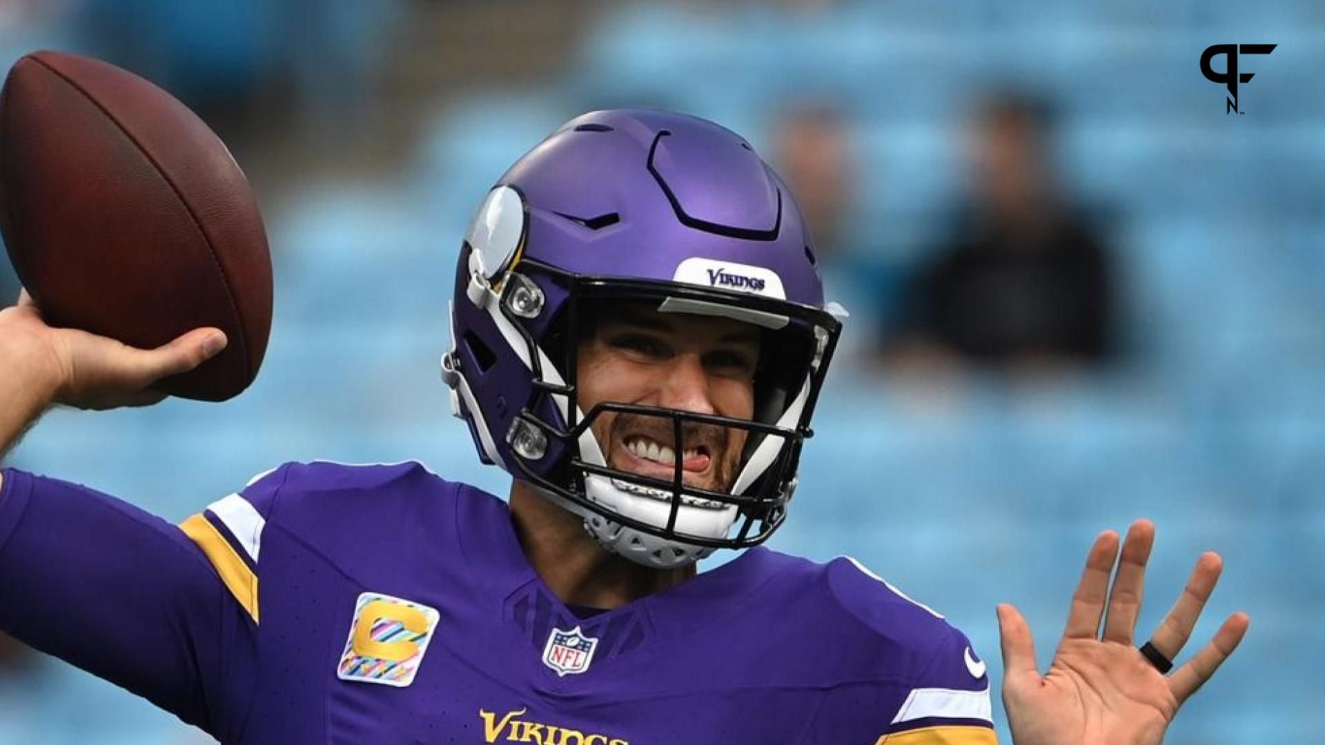 Minnesota Vikings quarterback Kirk Cousins (8) warms up before the game at Bank of America Stadium.