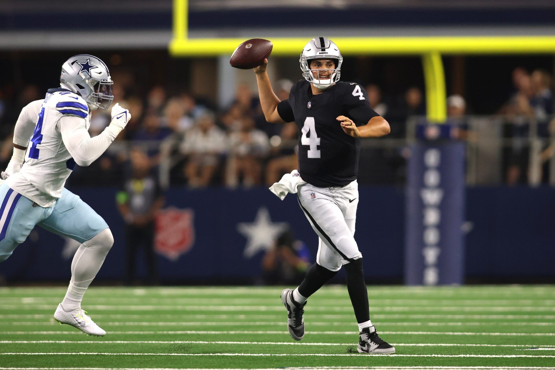 Las Vegas Raiders QB Aidan O'Connell (4) throws a pass against the Dallas Cowboys.