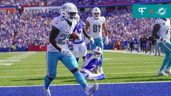 De'Von Achane (28) reacts to scoring a touchdown against the Buffalo Bills during the first half at Highmark Stadium.