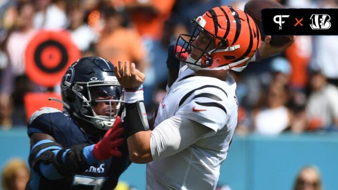 Joe Burrow (9) is hit by Tennessee Titans linebacker Azeez Al-Shaair (2) as he throws the ball during the first half at Nissan Stadium.