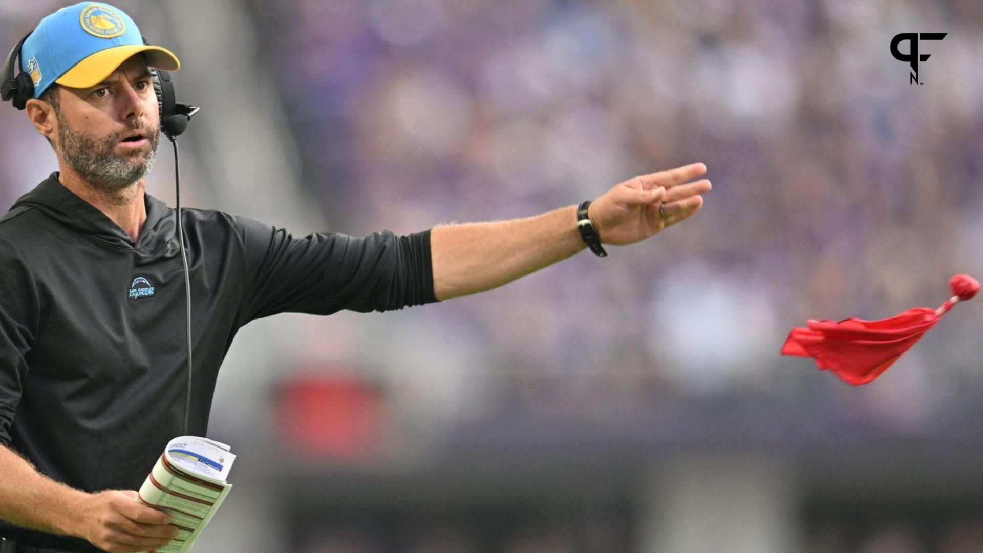 Los Angeles Chargers head coach Brandon Staley throws the red challenge flag during the second quarter against the Minnesota Vikings at U.S. Bank Stadium.