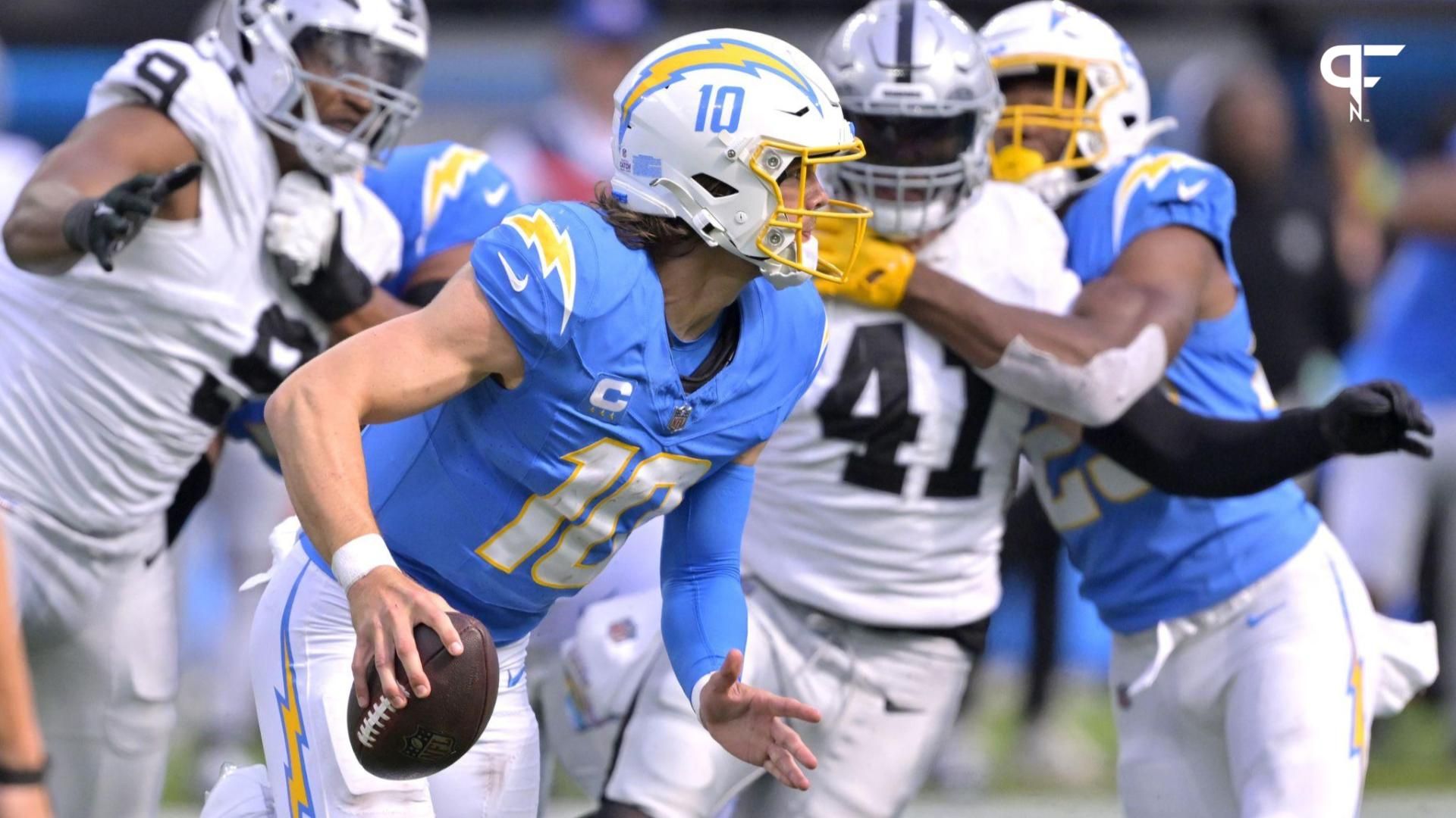 Justin Herbert (10) throws a pass in the second half against the Las Vegas Raiders at SoFi Stadium.