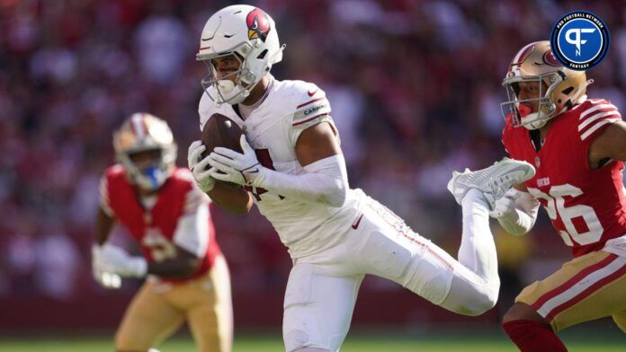 Michael Wilson (14) catches a pass in front of San Francisco 49ers cornerback Isaiah Oliver (26) in the fourth quarter at Levi's Stadium.