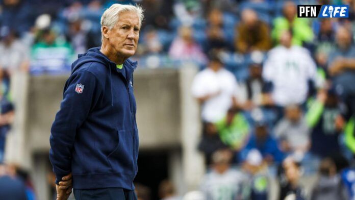 Seattle Seahawks head coach Pete Carroll watches pregame warmups against the Carolina Panthers at Lumen Field.