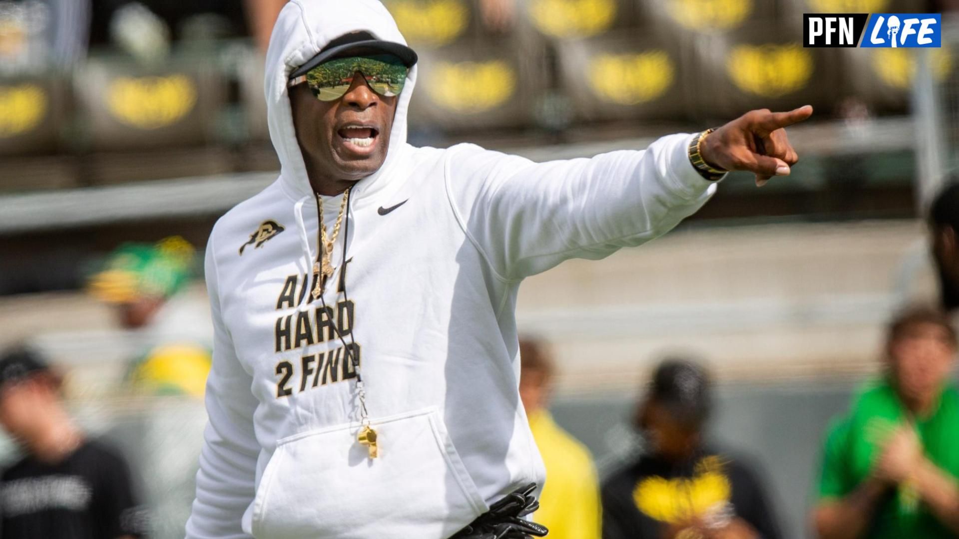 Colorado Buffaloes head coach Deion Sanders yells to team before game.