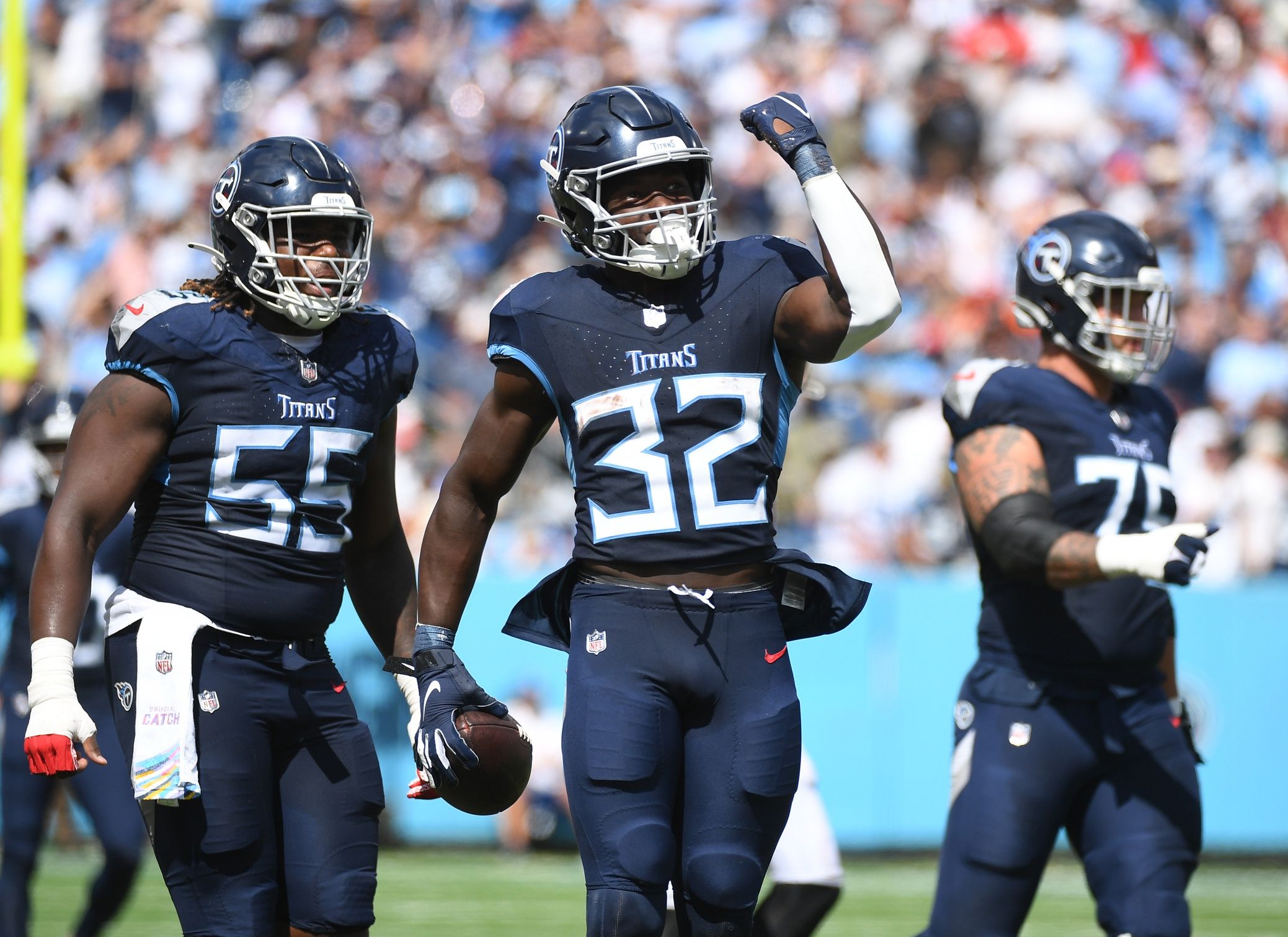 Tyjae Spears (32) celebrates after a first down run during the first half against the Cincinnati Bengals at Nissan Stadium.