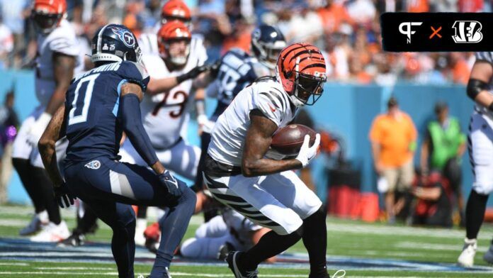 Tee Higgins (5) runs after a catch during the first half against the Tennessee Titans at Nissan Stadium.