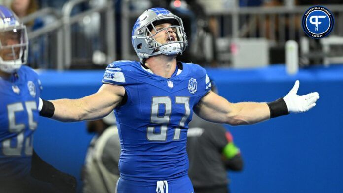 Aidan Hutchinson (97) celebrates after sacking Atlanta Falcons quarterback Desmond Ridder (9) (not pictured) and forcing a fumble in the fourth quarter at Ford Field.