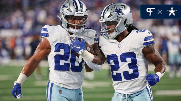 Tony Pollard (20) and running back Rico Dowdle (23) warm up before the game against the New York Giants at MetLife Stadium.