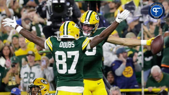 Romeo Doubs (87) after scoring a touchdown against the Detroit Lions.