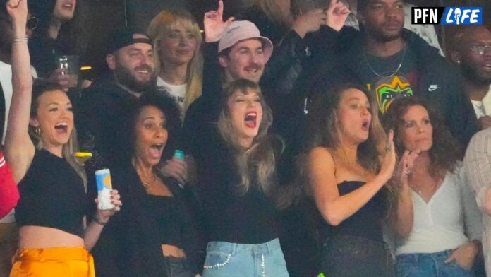 Taylor Swift, a guest of Kansas City Chiefs tight end Travis Kelce (87), cheers during the game at MetLife Stadium.