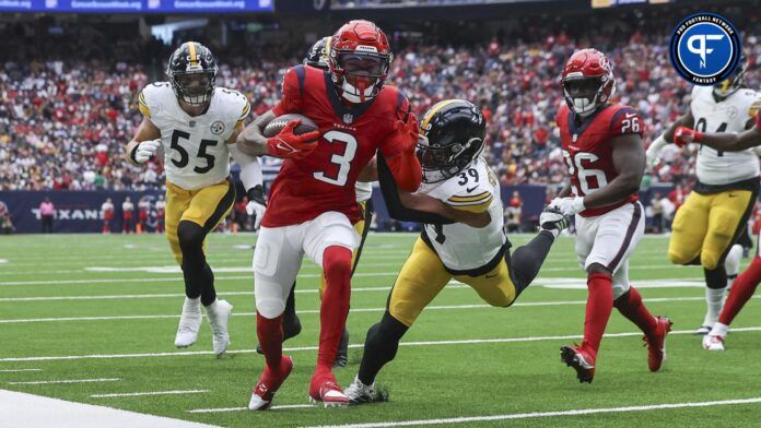 Tank Dell (3) runs with the ball as Pittsburgh Steelers safety Minkah Fitzpatrick (39) attempts to make a tackle during the first quarter at NRG Stadium.