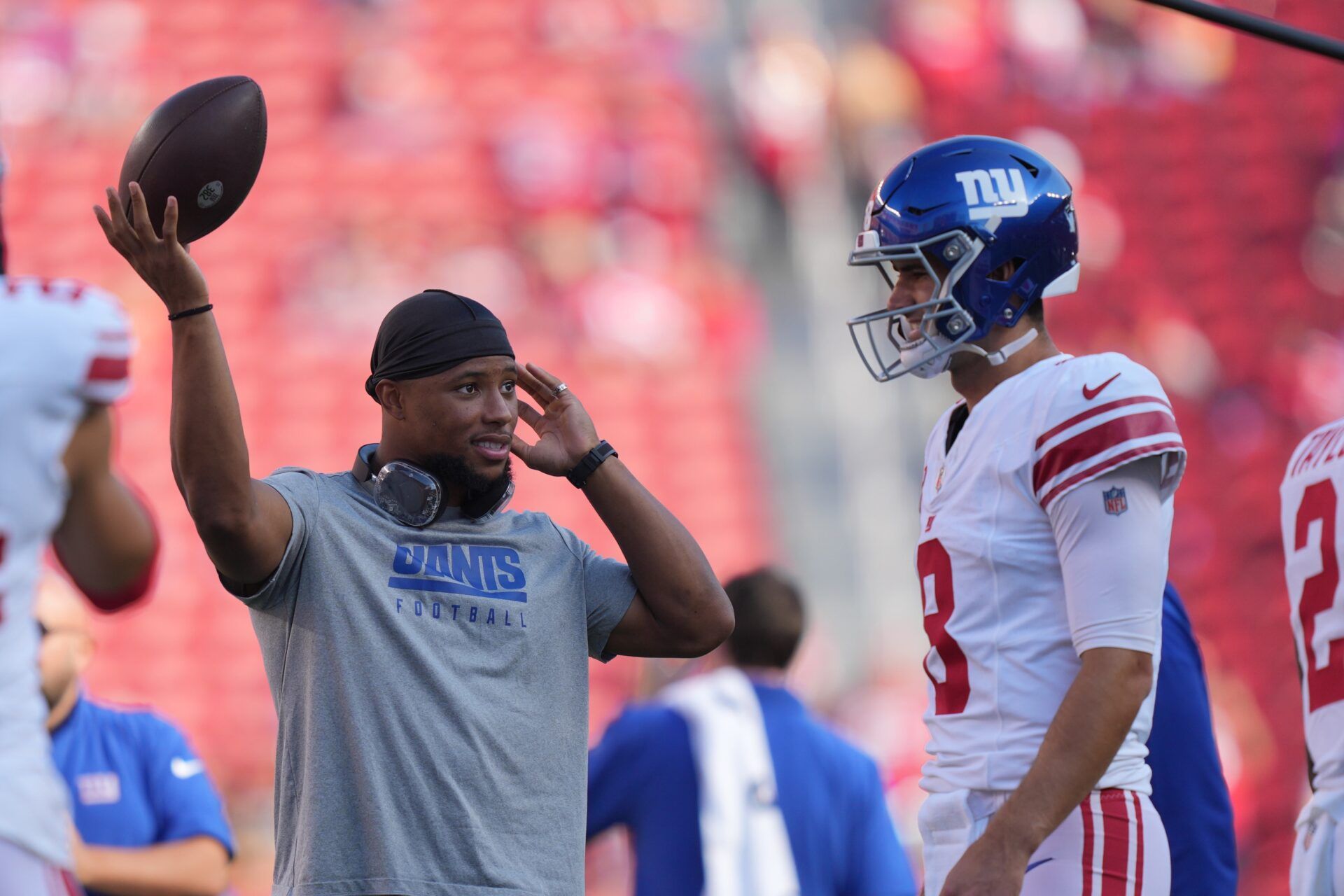 Saquon Barkley (left) talks to quarterback Daniel Jones (8) before the game against the San Francisco 49ers at Levi's Stadium.