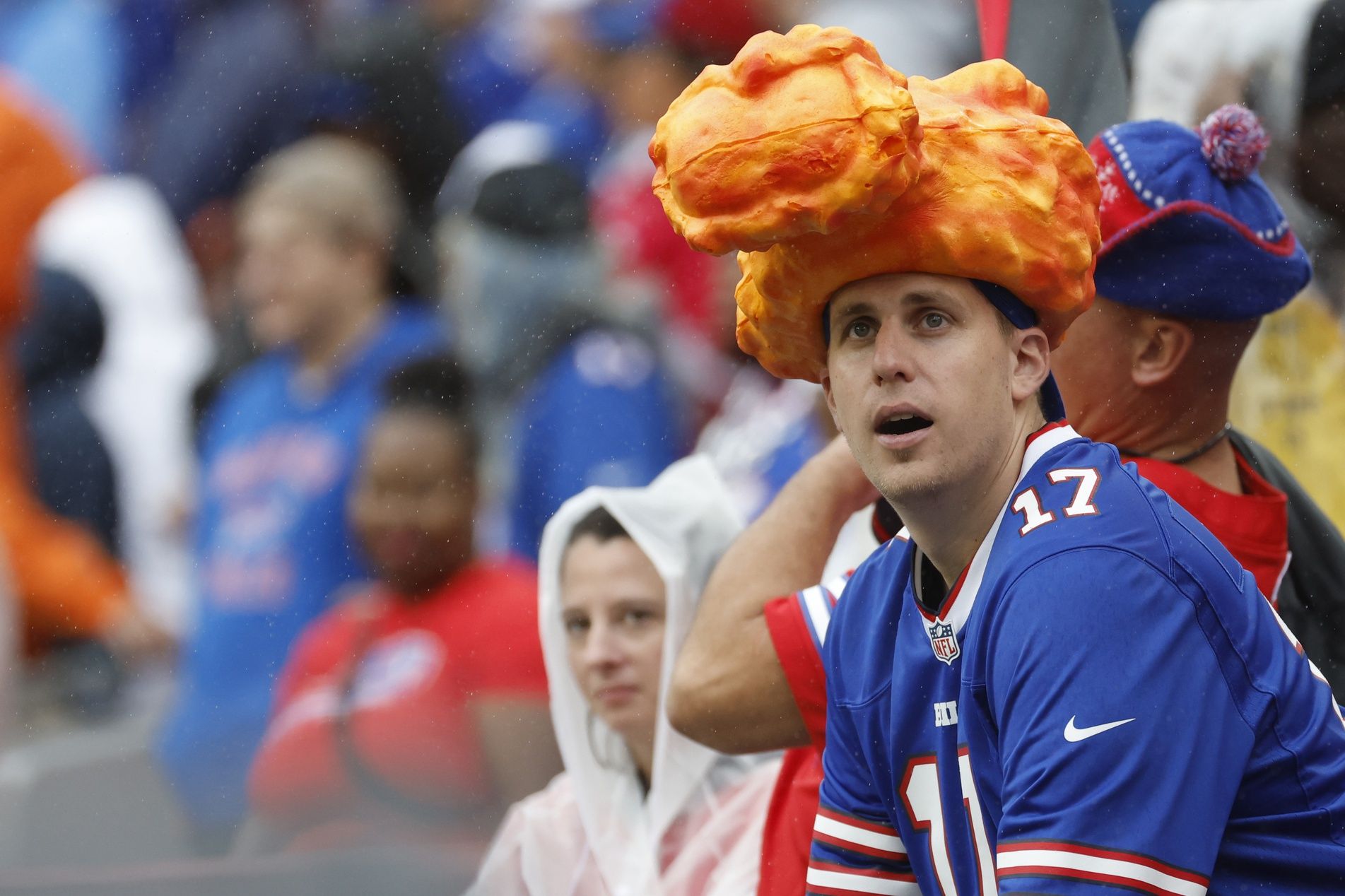 A Buffalo Bills fan takes his takes his Buffalo-inspired hat to a Washington Commanders game.