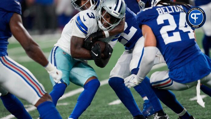 Dallas Cowboys WR Brandin Cooks (3) is tackled by a group of New York Giants defenders.