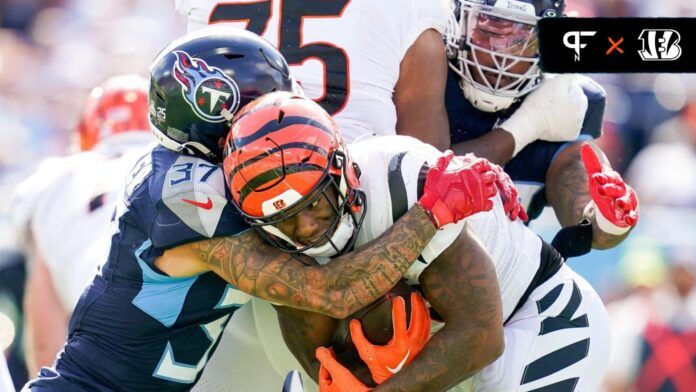 Cincinnati Bengals RB Joe Mixon (28) is tackled by the Tennessee Titans.