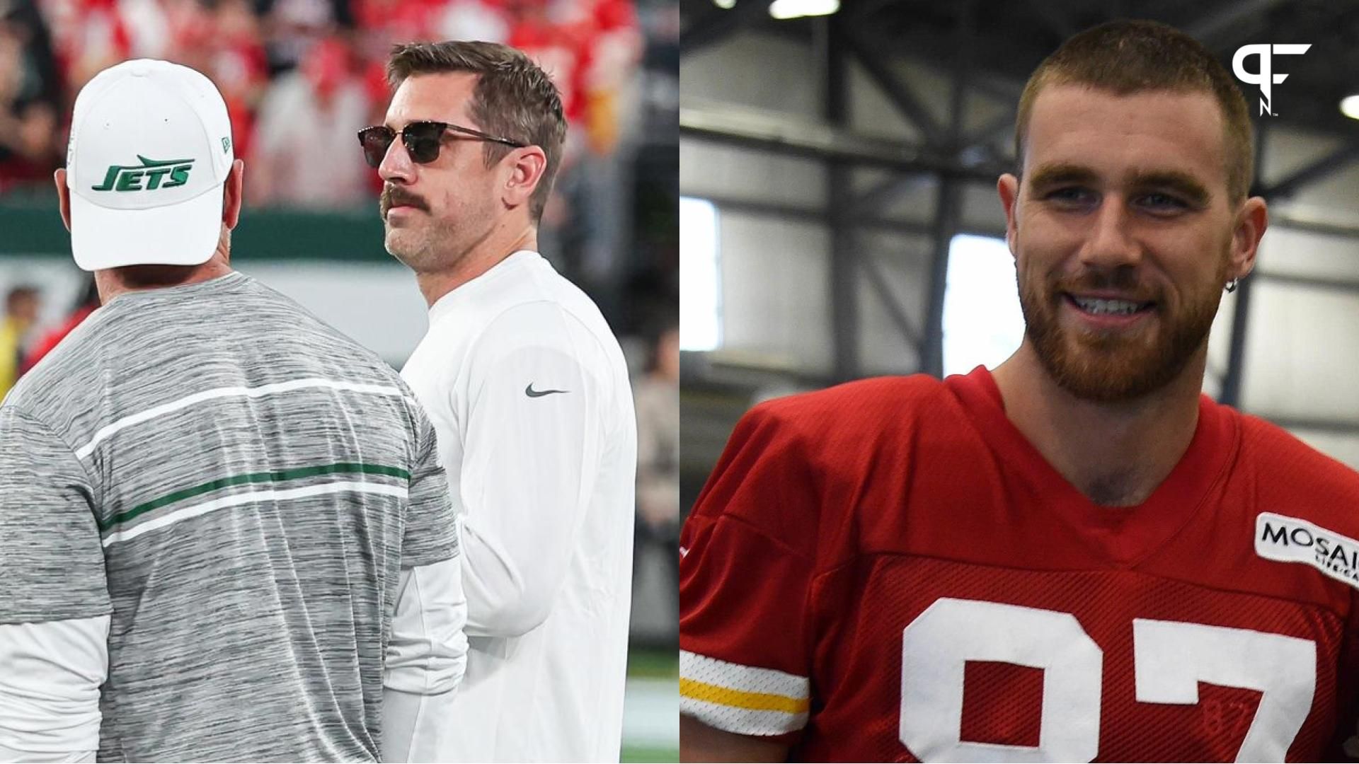 New York Jets quarterback Aaron Rodgers (8) talks with a member of the Jets staff before the game against the Kansas City Chiefs at MetLife Stadium.