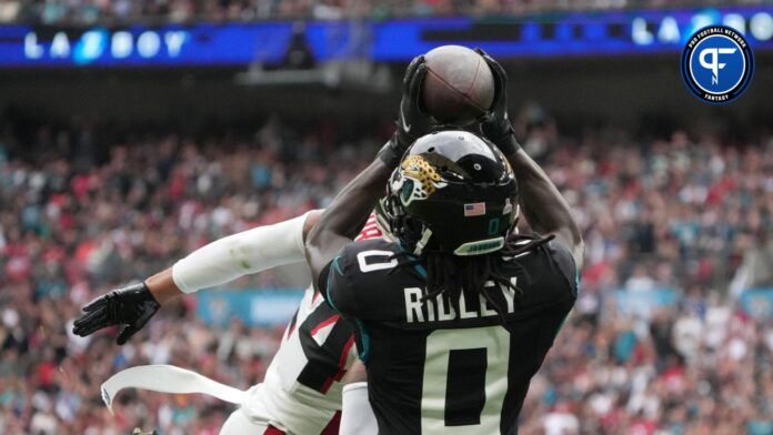 Jacksonville Jaguars wide receiver Calvin Ridley (0) catches a 39-yard touchdown pass against Atlanta Falcons cornerback A.J. Terrell (24) in the first half during an NFL International Series game at Wembley Stadium.