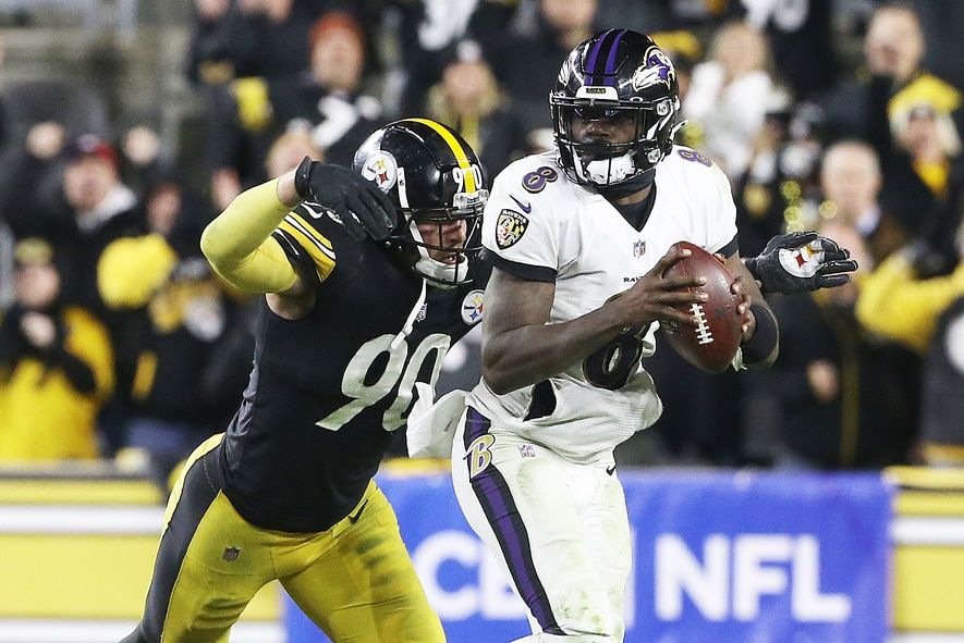 Pittsburgh Steelers DE T.J. Watt (90) pressures Baltimore Ravens QB Lamar Jackson (8).