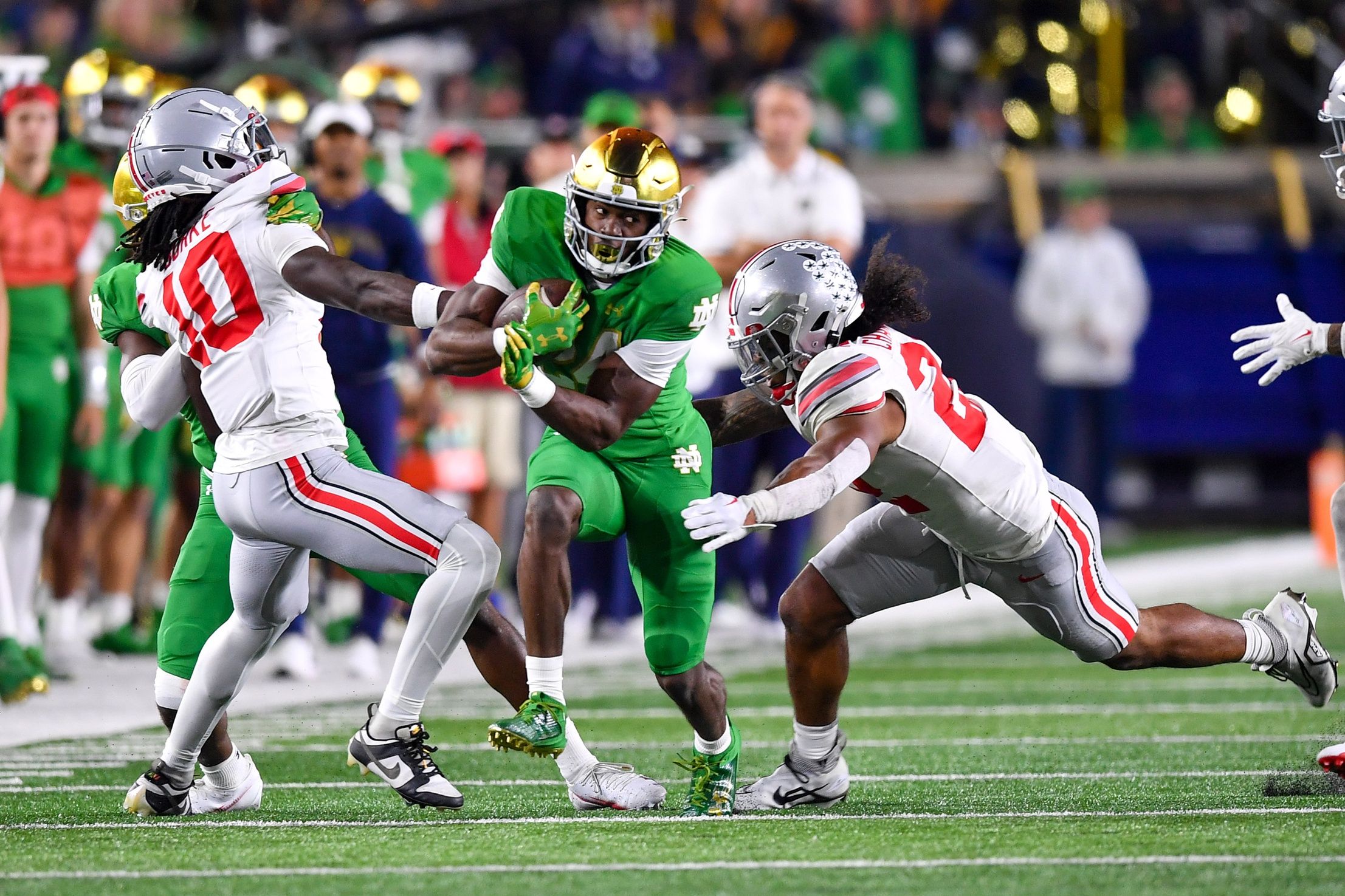 Denzel Burke attempts to make a tackle against Notre Dame.