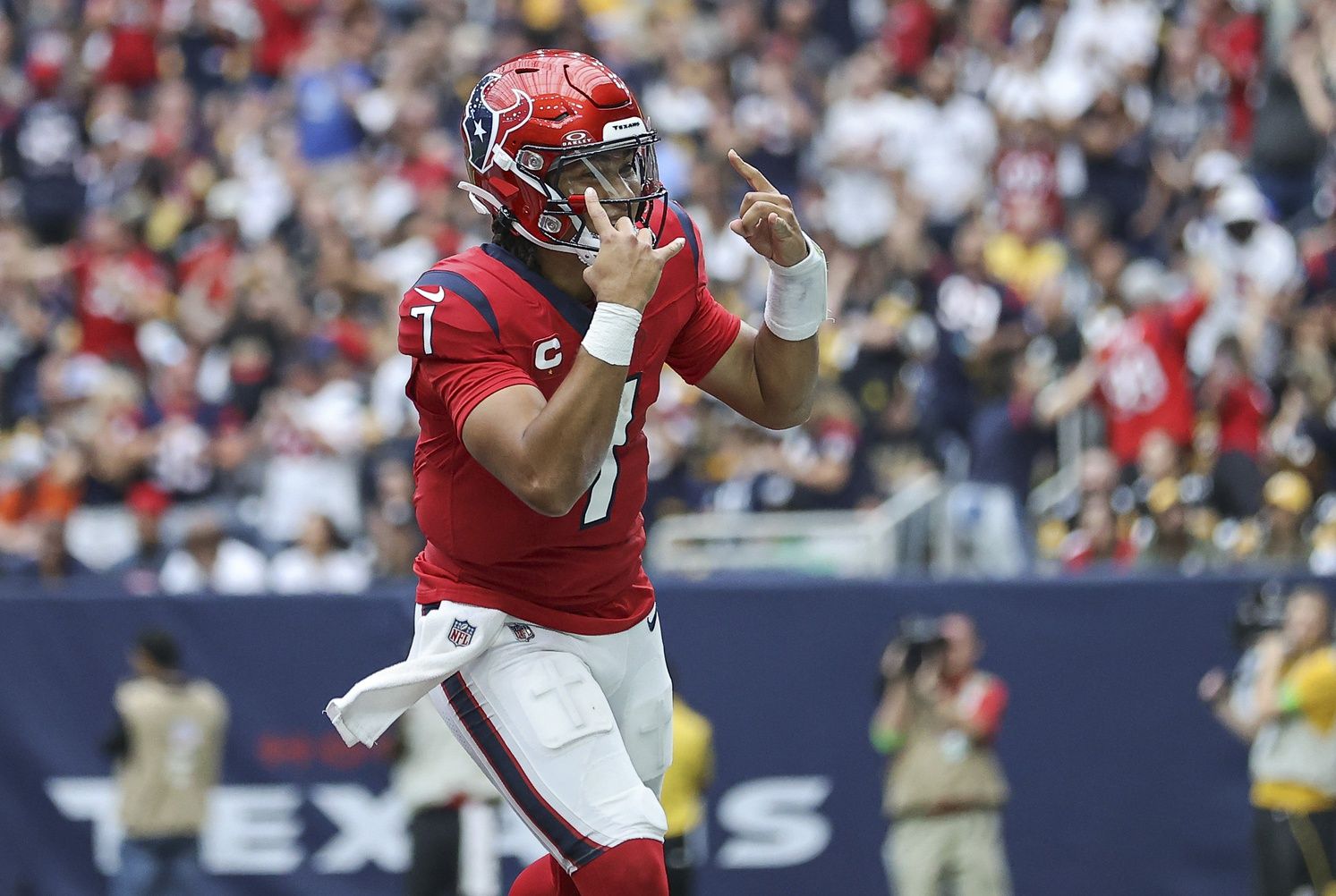 C.J. Stroud (7) celebrates after a touchdown during the fourth quarter against the Pittsburgh Steelers at NRG Stadium.