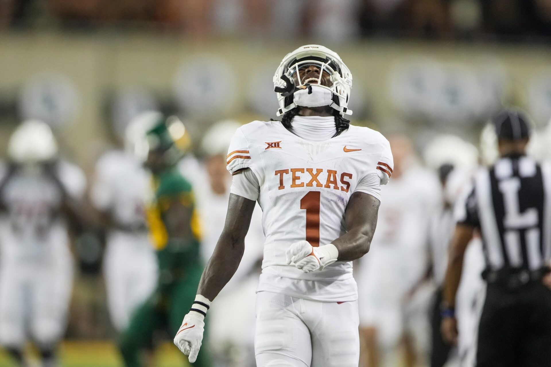 Xavier Worthy (1) celebrates big yardage on a kick return against Baylor in the second quarter of an NCAA college football game.