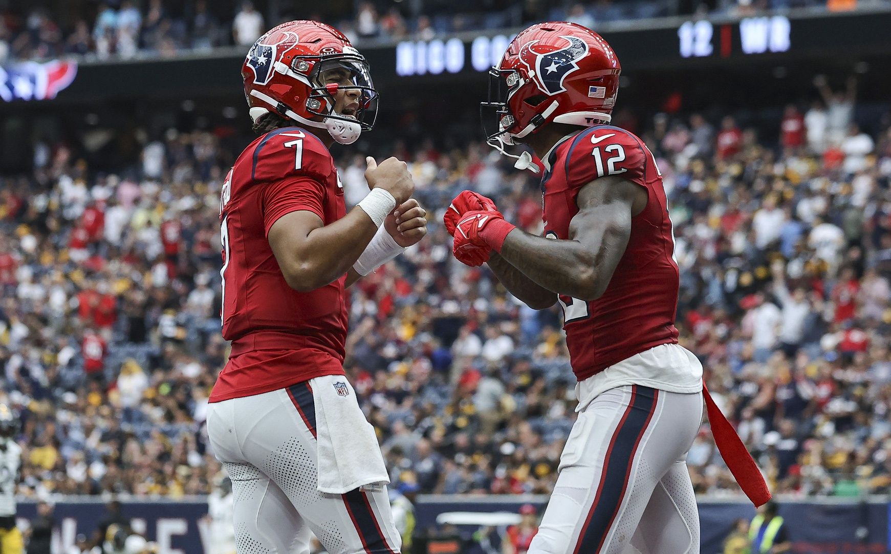 C.J. Stroud (7) celebrates with wide receiver Nico Collins (12) after a touchdown during the game against the Pittsburgh Steelers at NRG Stadium.