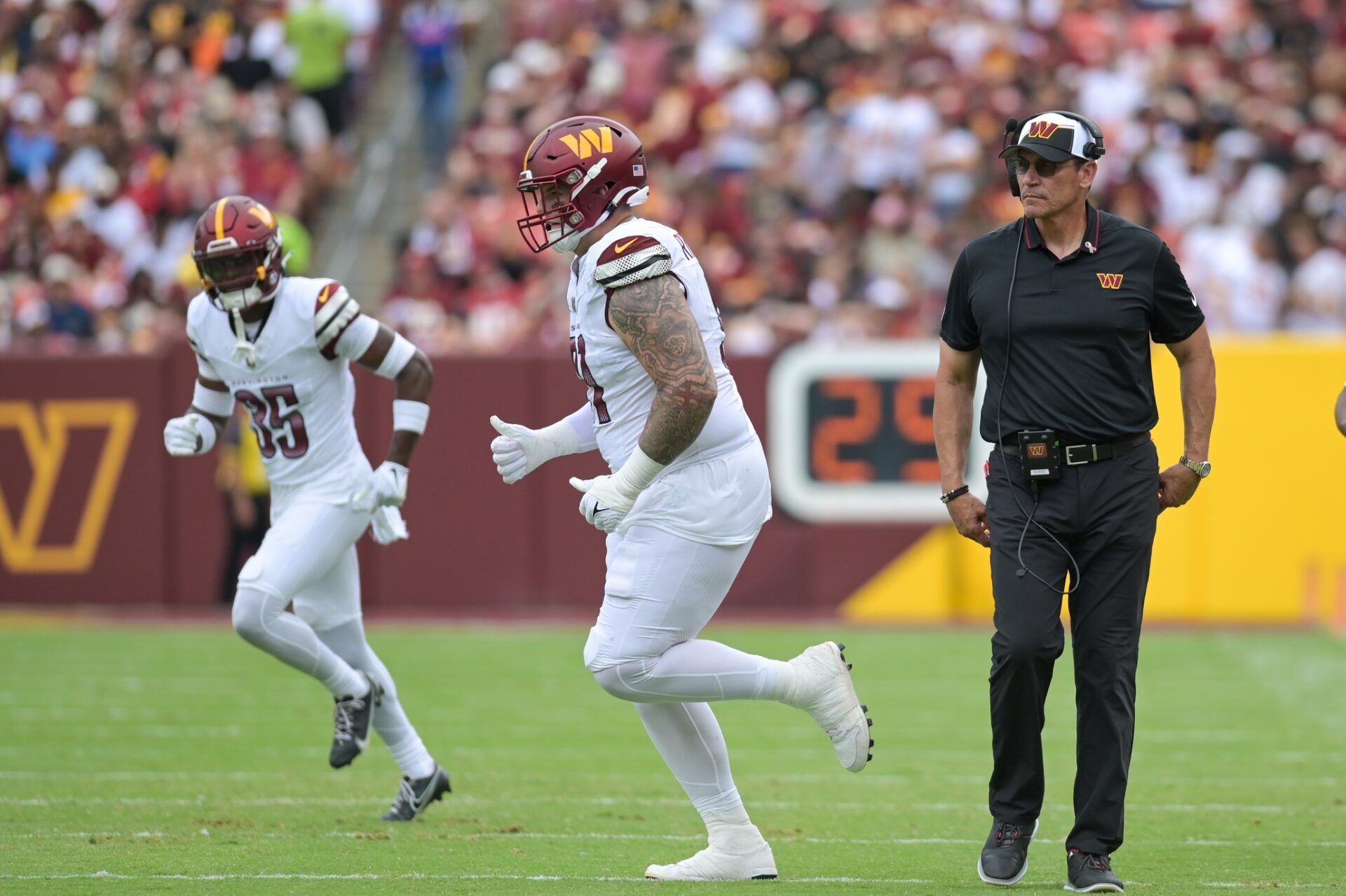 Washington Commanders head coach Ron Rivera walks down the field durng a stop in play during the second half of the game Arizona Cardinals.