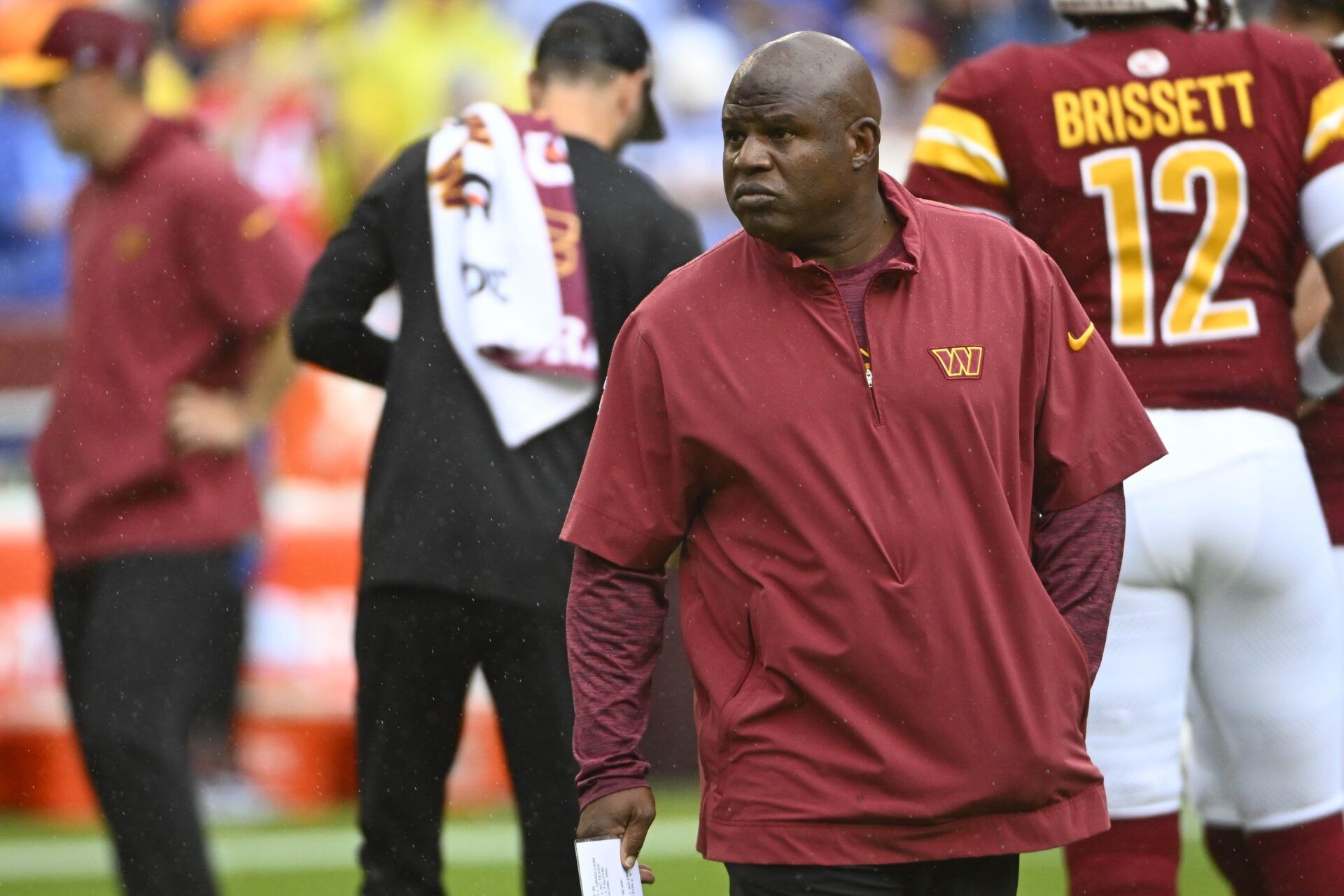 Washington Commanders offensive coordinator Eric Bieniemy on the field prior to a game.