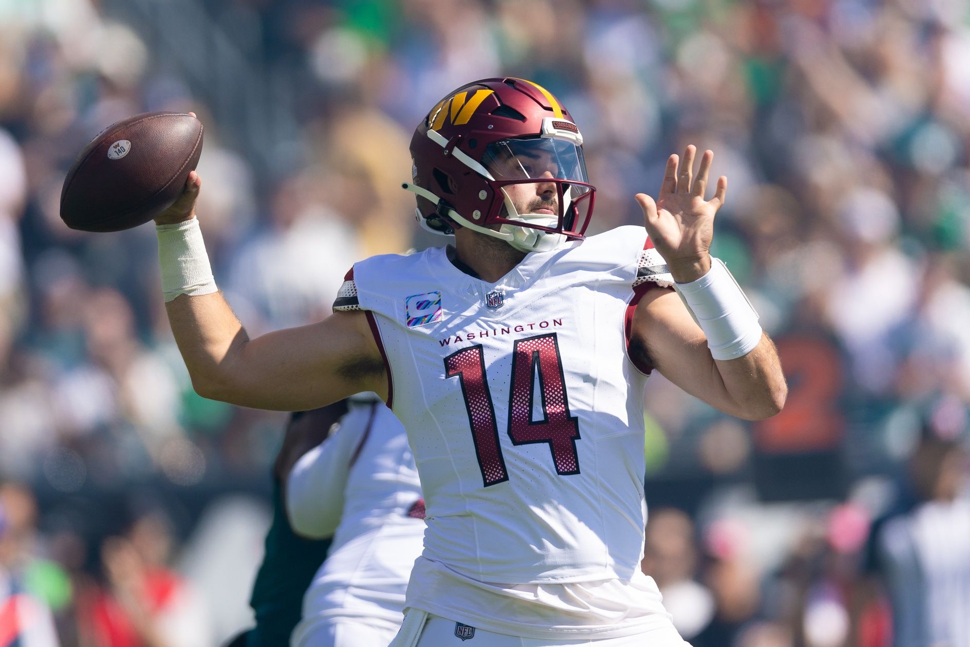 Washington Commanders QB Sam Howell (14) throws the ball against the Philadelphia Eagles.