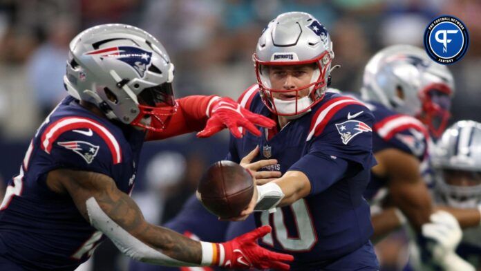 New England Patriots QB Mac Jones hands football of to RB Ezekiel Elliot in game vs. Dallas Cowboys.