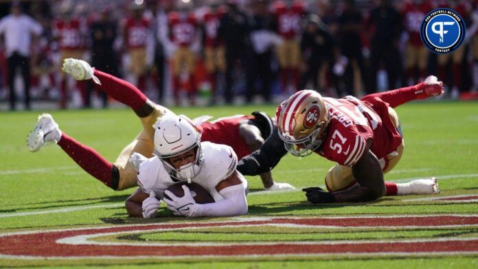 Arizona Cardinals wide receiver Michael Wilson (14) catches a touchdown in front of San Francisco 49ers linebacker Dre Greenlaw.