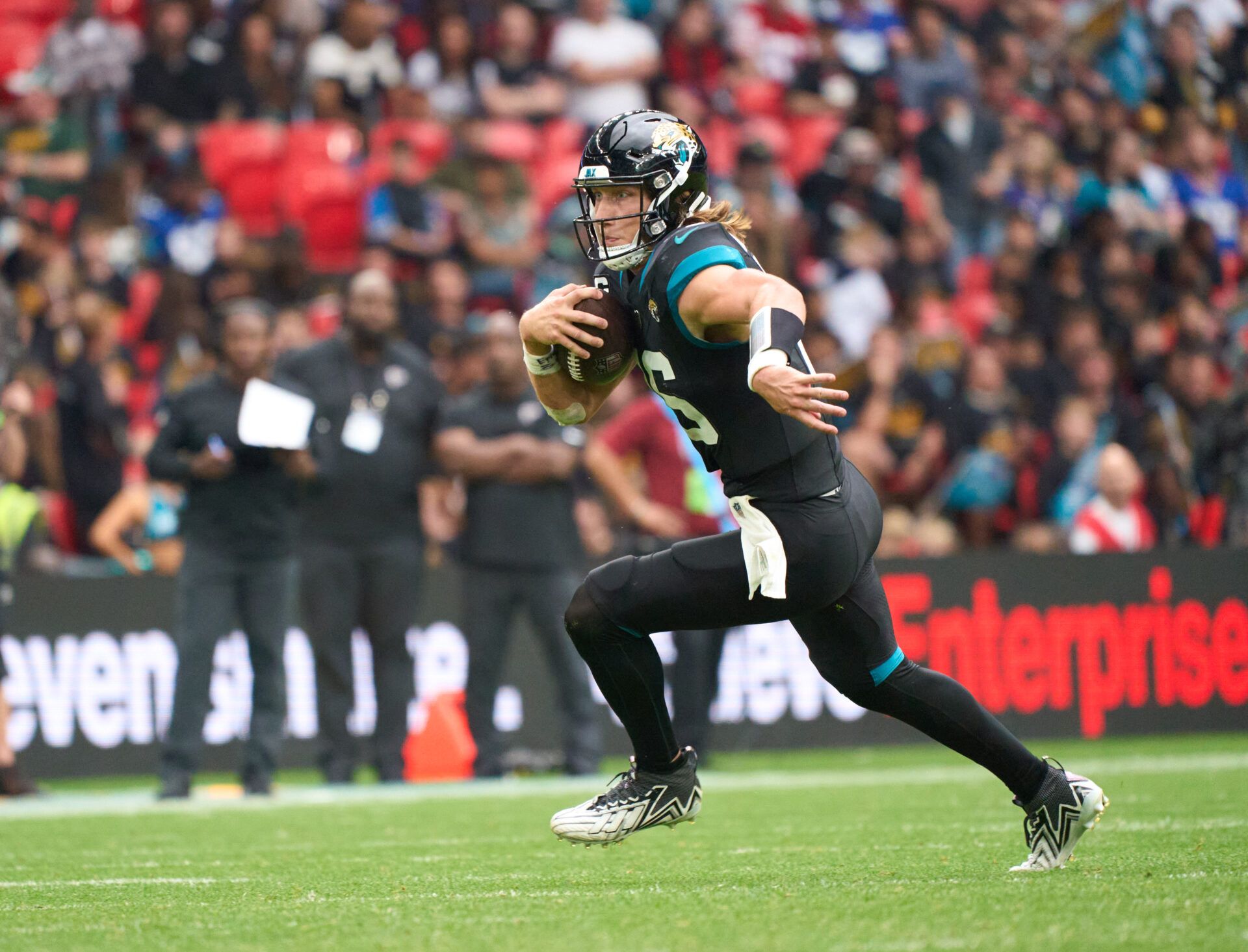 Oct 1, 2023; London, United Kingdom; Jacksonville Jaguars quarterback Trevor Lawrence (16) carries the ball during the second half of an NFL International Series game at Wembley Stadium.
