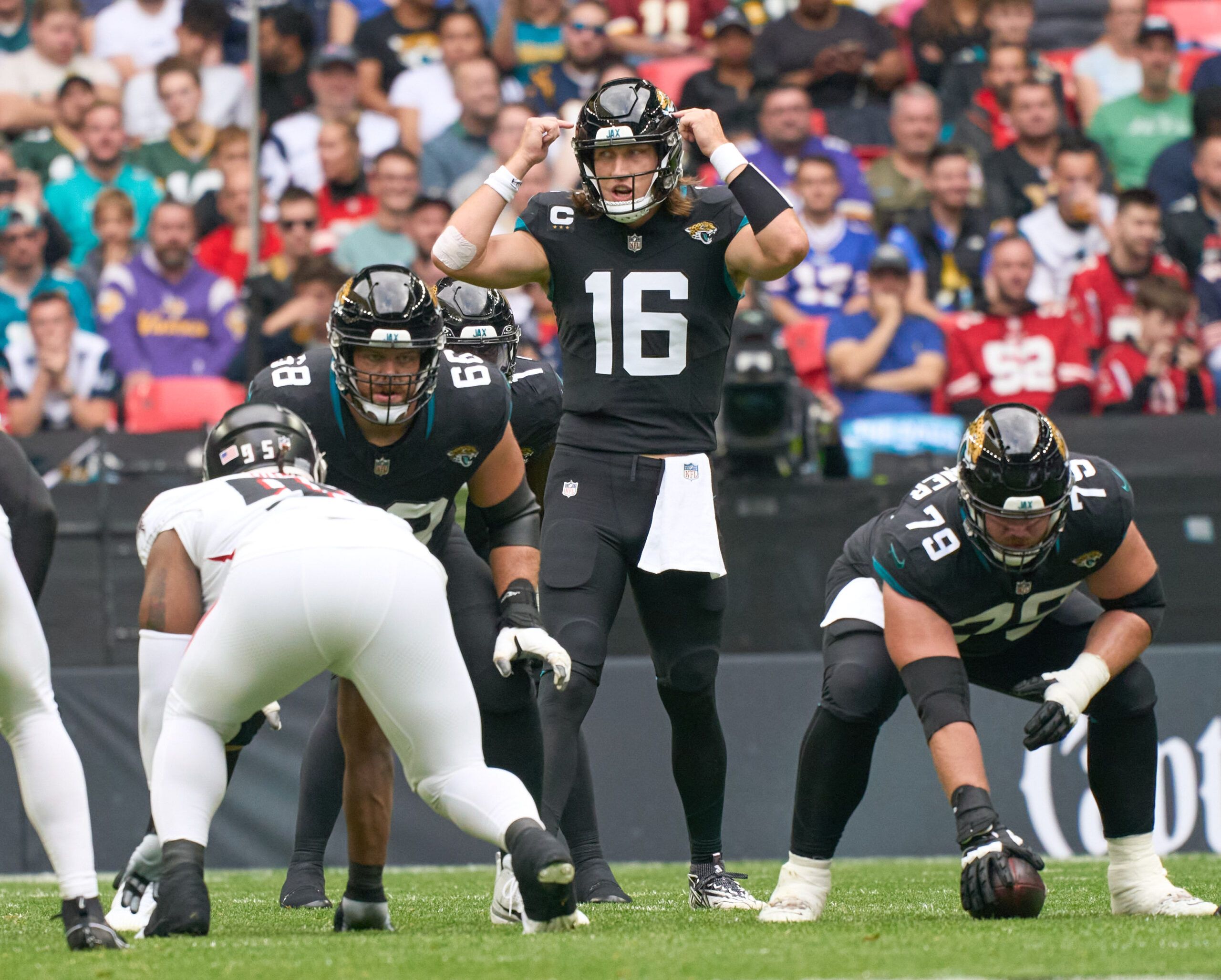 Oct 1, 2023; London, United Kingdom; Jacksonville Jaguars quarterback Trevor Lawrence (16) calls out to his team mates during the first half of an NFL International Series game at Wembley Stadium.