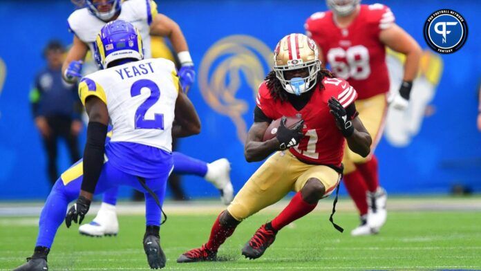 San Francisco 49ers wide receiver Brandon Aiyuk (11) runs the ball against Los Angeles Rams safety Russ Yeast (2) during the second half.